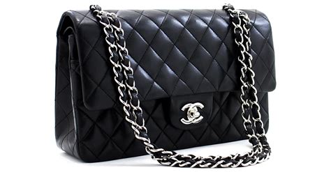 CHANEL Borsa a tracolla con patta esterna e coulisse, zaino con .